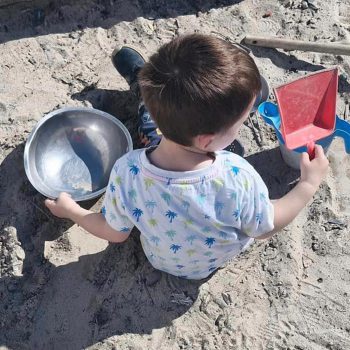 Little boy playing on the sand at Deansrath Family Centre